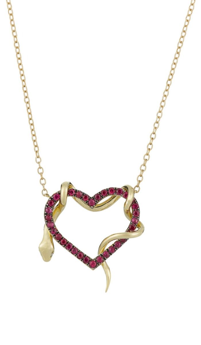 A heart and snake pendant necklace by Finn. In gold, with rubies on the heart an...