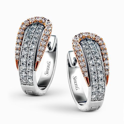 The modern design of these white and rose gold earrings is accentuated by .84 ct...