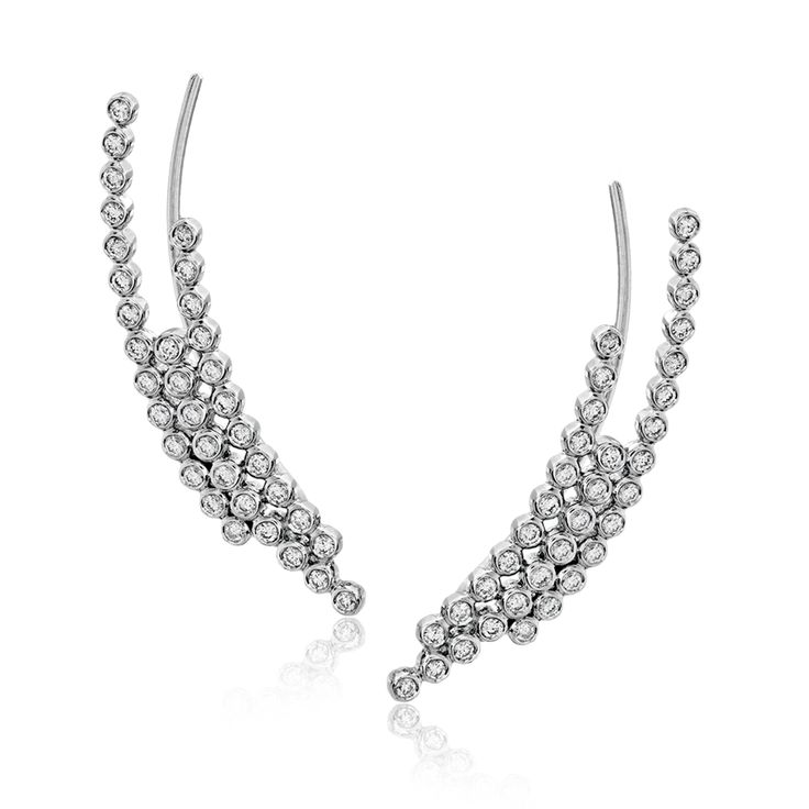 These fashionable climber earrings contain a stunning .62 ctw of white diamonds ...