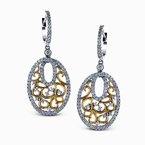 Reflecting a lacy drop design, these vintage style two-tone earrings feature 1.0...