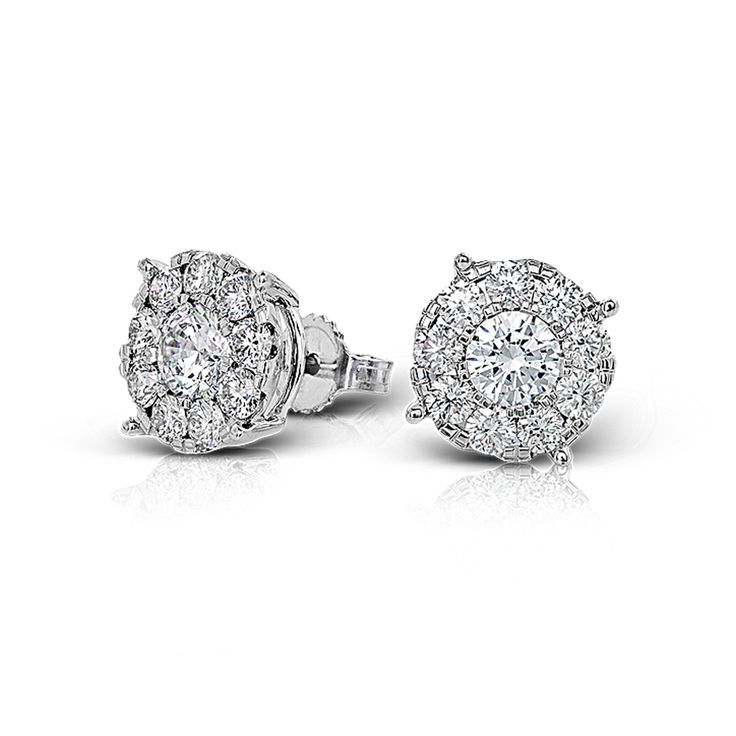 These 18k white gold stud earrings feature .50 ctw diamond centers surrounded by...