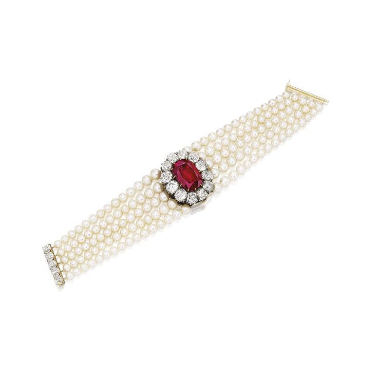 A rare ruby, diamond, and natural pearl bracelet, centering on an antique cushio...