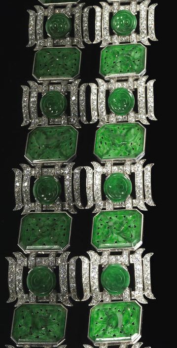 A jadeite jade, diamond and platinum bracelet the link bracelet featuring floral...