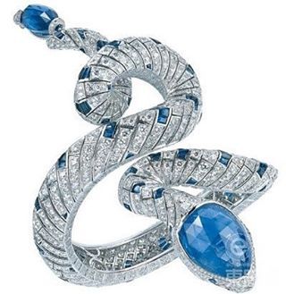 A sapphire and diamond snake bangle, by Cartier. Cartier #natureinspiredjewelry ...