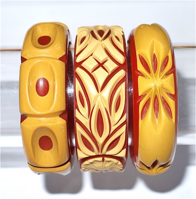 Cast carved butterscotch and red bakelite bracelets.