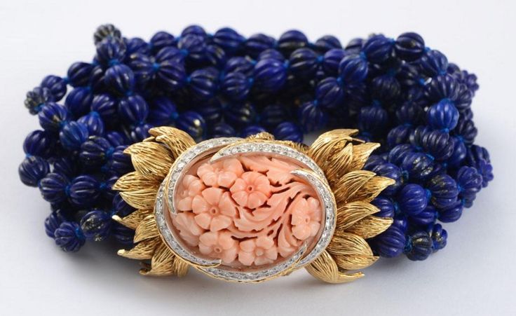 LAPIS BEAD, CORAL AND DIAMOND BRACELET, DAVID WEBB.  With carved lapis beads and...