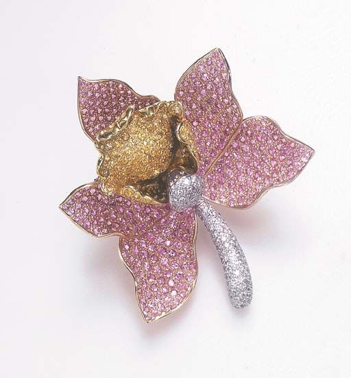 A DIAMOND AND COLORED SAPPHIRE BROOCH Designed as a sculpted pavé-set pink and ...