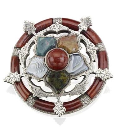 A Victorian Scottish agate brooch Of stylised snowflake design, set with vari-cu...
