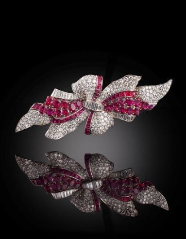 An art deco diamond and ruby double clip brooch, Trabert & Hoeffer-Mauboussin, c...