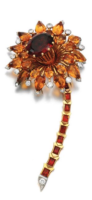 Citrine and diamond brooch, Cartier, circa 1940 The flower set with oval and pea...