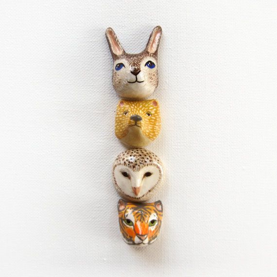 These are brooches! Etsy seller Handy Maiden makes animal head brooches.
