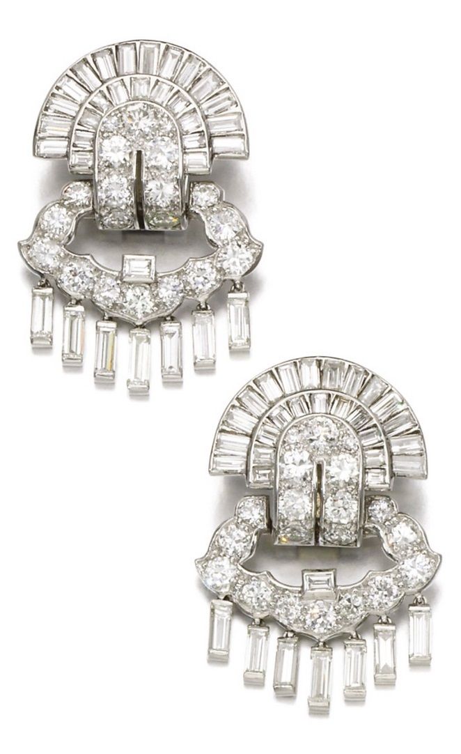 A pair of Art Deco diamond earrings, Cartier, 1930s. Each articulated earring of...