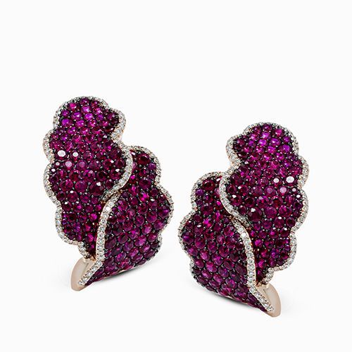 Featuring a contemporary wavy design, these striking earrings are emphasized by ...