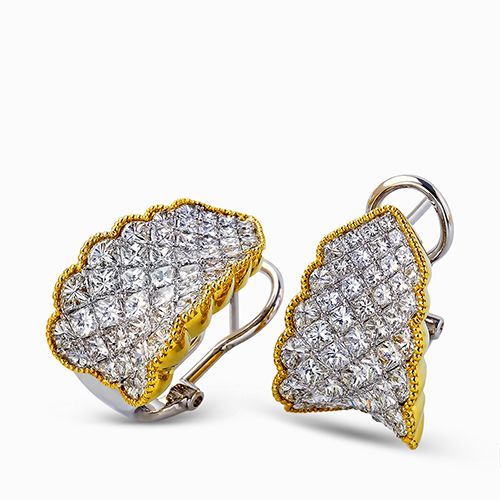 Featuring a dramatic contemporary style, these two-tone earrings are highlighted...