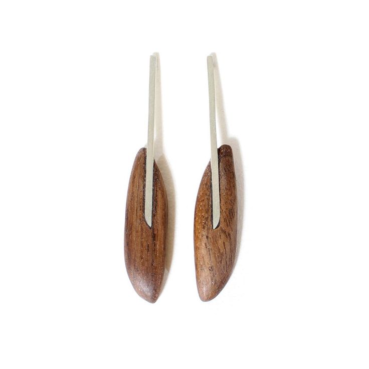 Hand-carved walnut with a sterling silver inlay. These lightweight earrings make...