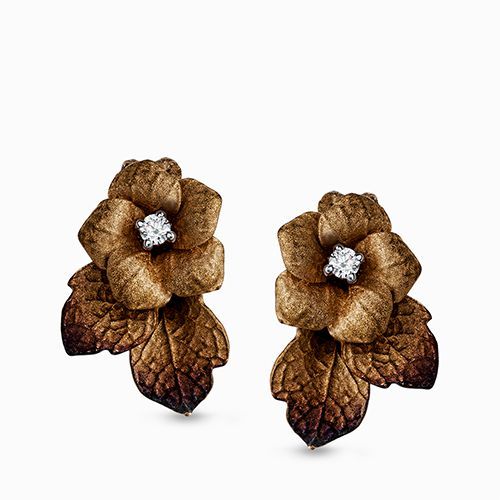 The arresting beauty of flowers was the inspiration for these unique earrings. T...