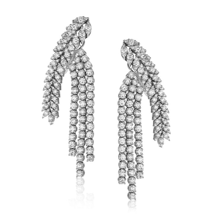 These cascading earrings are a red carpet favorite with 8.78 ctw of white diamon...