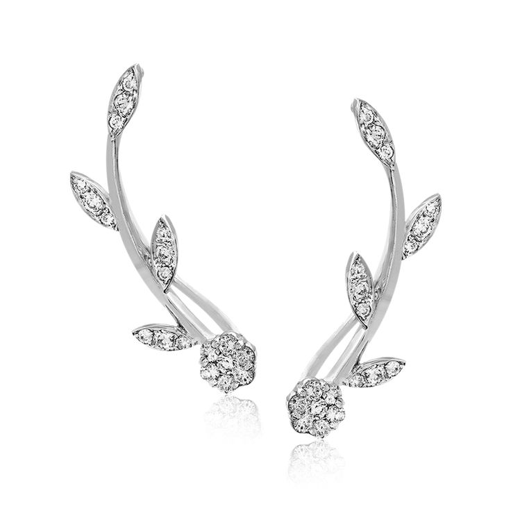 These climber earrings extend up the ear with a floral-inspired 18k white gold d...