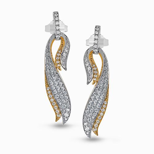 These eye-catching earrings feature a modern two-tone cascade design with .94 ct...
