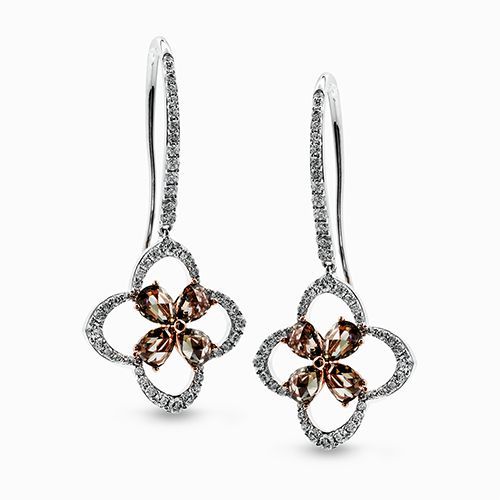 These impressive earrings contain .55 ctw of white diamonds in a charming settin...