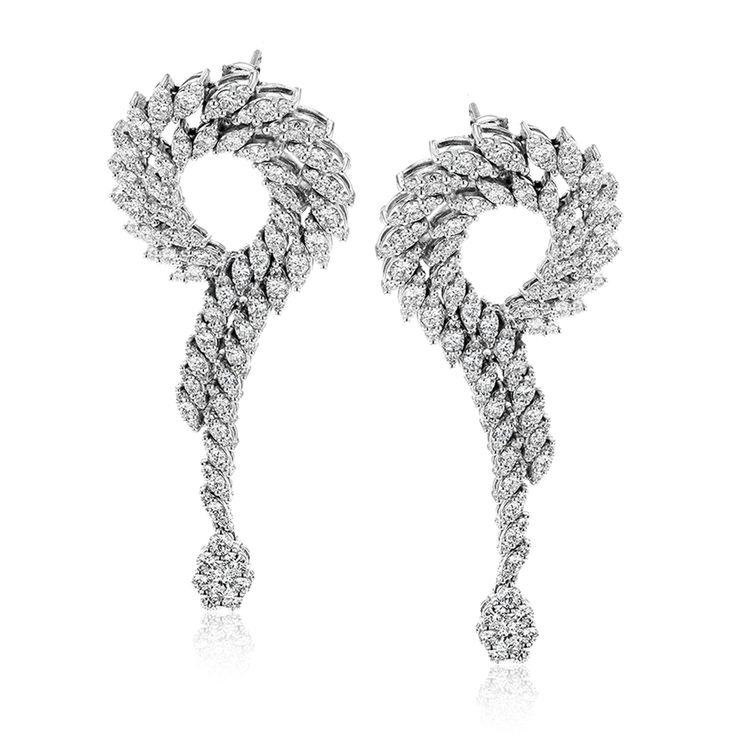 These stunning 18k white gold earrings contain 4.51 ctw of white diamonds within...