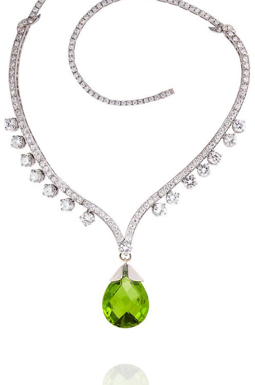 A diamond and peridot necklace,   designed as a ‘V’ shaped pavé-set diamond...