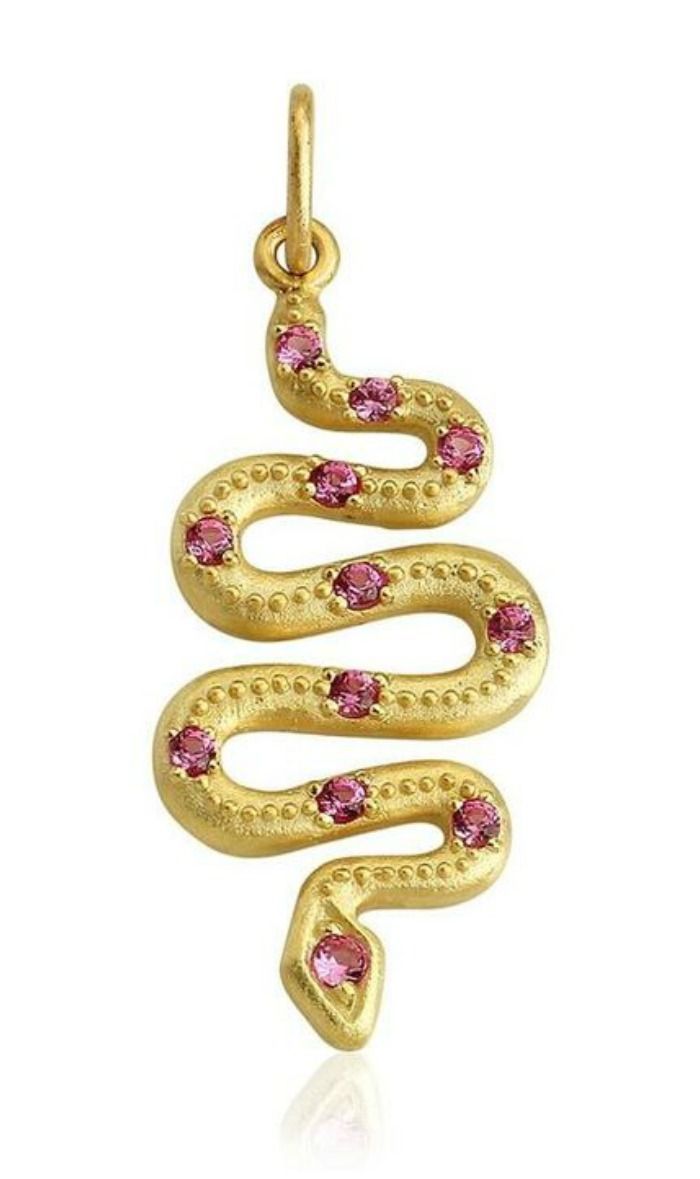 A gold and gemstone snake pendant by Stella Flame jewelry.