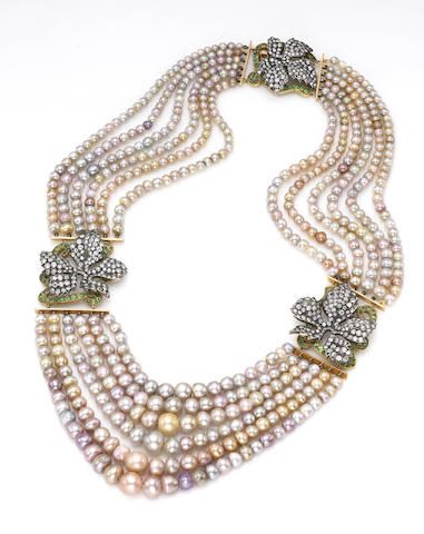 A six-row natural pearl, diamond and demantoid garnet necklace valued at between...