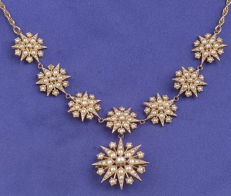 A victorian seed pearl and 9 karat gold starburst necklace, comprising seven sta...