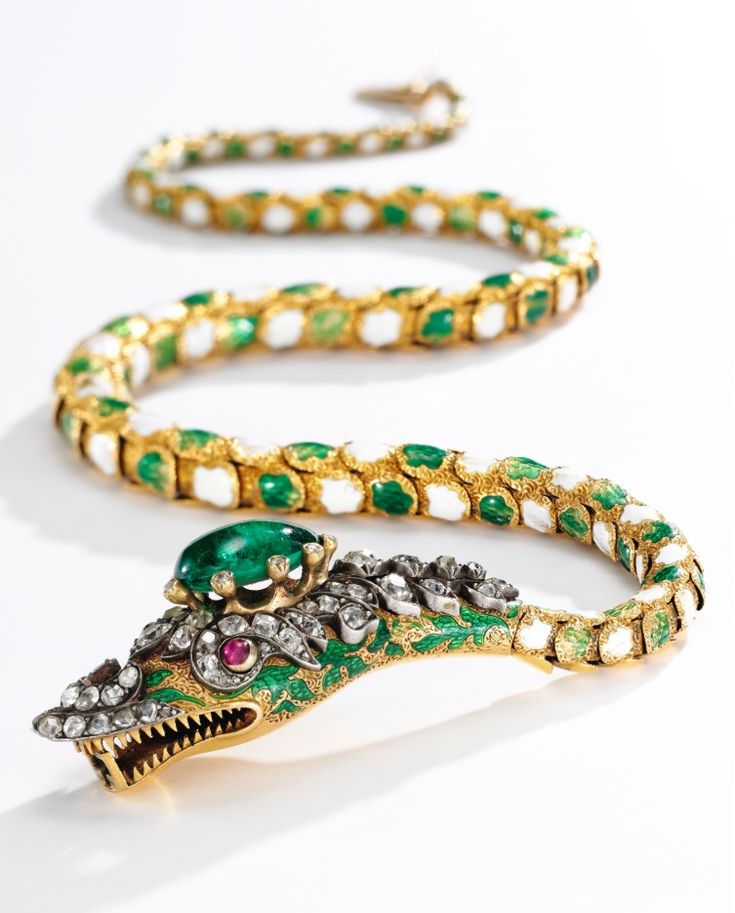 An antique emerald, ruby, enamel and diamond necklace, 1840s. Designed as a snak...