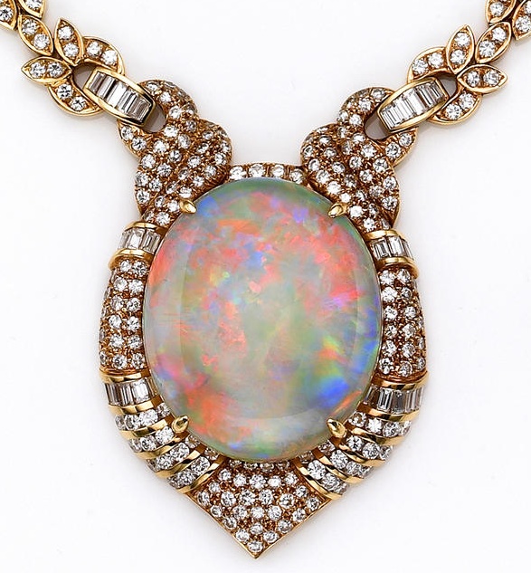 An opal, diamond and eighteen karat gold pendant necklace  centering an oval-sha...