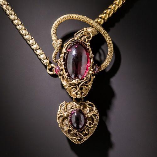 Garnet and gold snake with heart necklace.