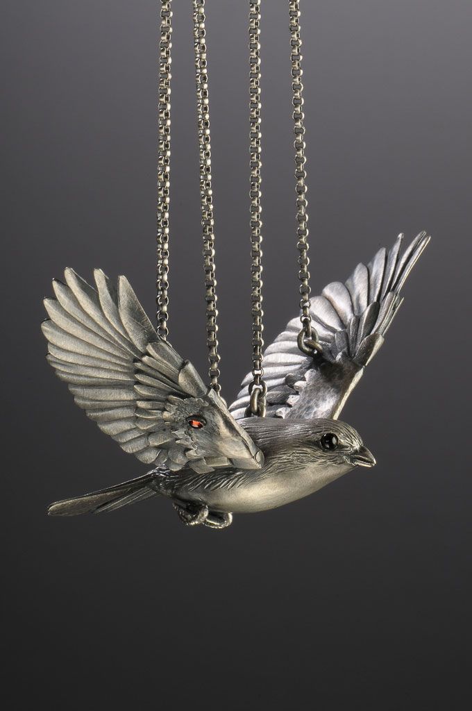 Garnet and silver bird necklace.