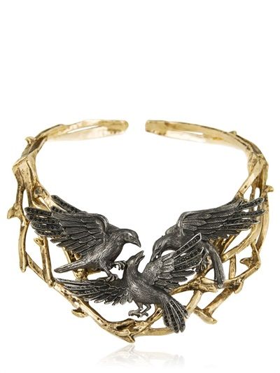 Silver and gold fighting crows necklace.