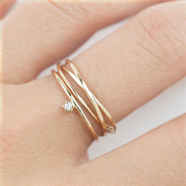 Gold streak trinity ring is made of intertwined 3 textured solid 14k gold rings ...