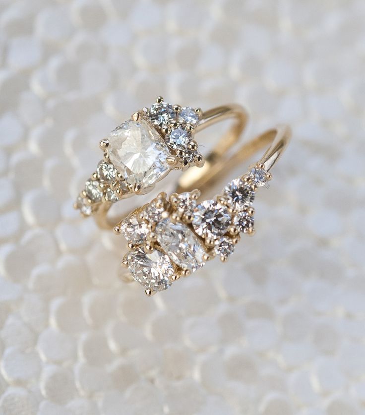 These cleverly-designed Custom Cluster Engagement Rings are made entirely of hei...