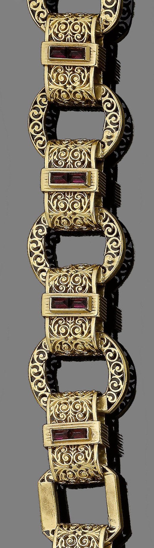 A late 19th century gold and garnet fancy-link bracelet.  Designed as a continuo...