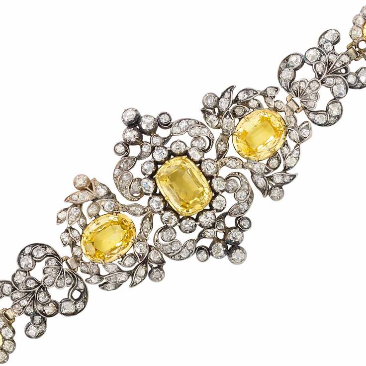 Antique Silver, Gold, Yellow Sapphire and Diamond Bracelet.  5 cushion-shaped & ...