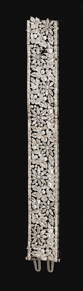 DIAMOND BRACELET, FRENCH, CIRCA 1915. The articulated open work band decorated w...