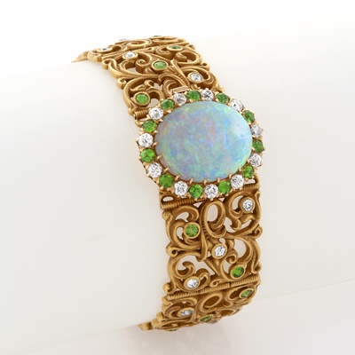 Opal, demantoid garnet, diamond and gold bracelet, American, attributed to Gusta...