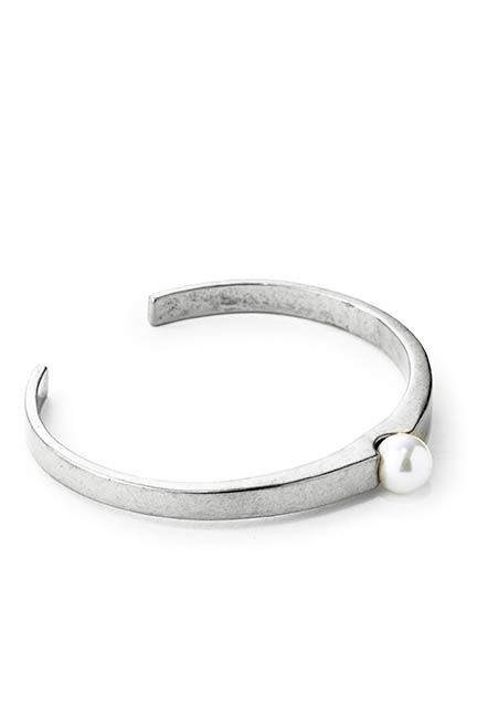 A modern take on the pearl; a simple everyday cuff.