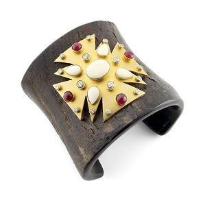 Wood and bakelite bracelet set with with a gold, diamond, spinel and white coral...