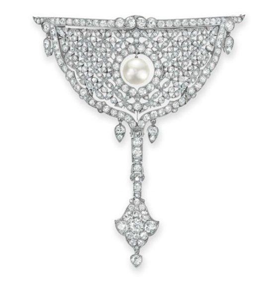 A BELLE ÉPOQUE DIAMOND AND NATURAL PEARL BROOCH, BY CARTIER   Designed as an op...