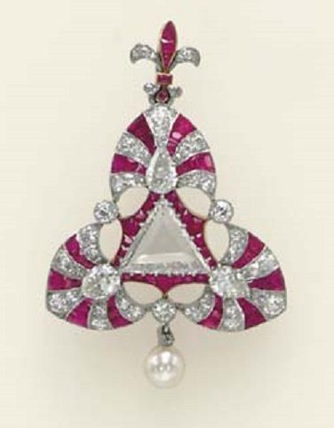 A BELLE ÉPOQUE DIAMOND, RUBY AND CULTURED PEARL PENDANT BROOCH. Centring upon a...
