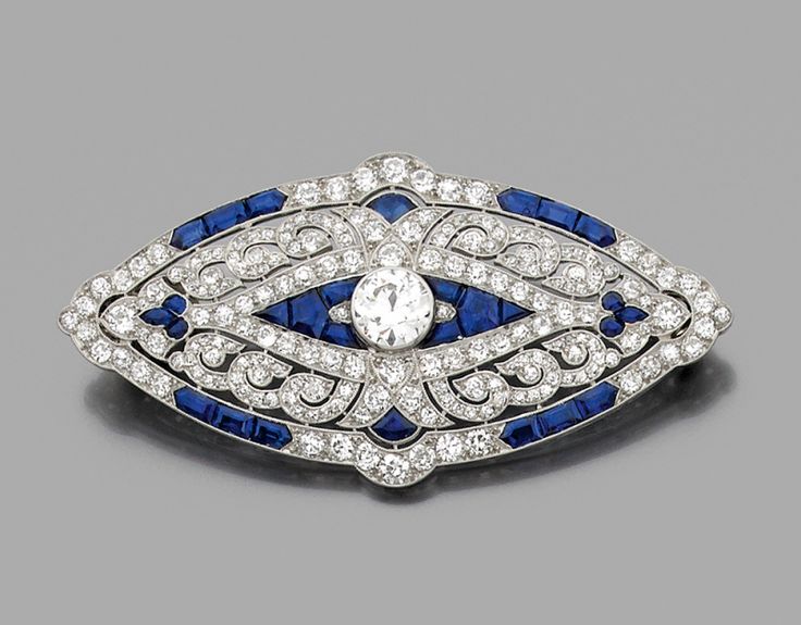 A diamond, sapphire and platinum Art Déco brooch by Mauboussin 1924