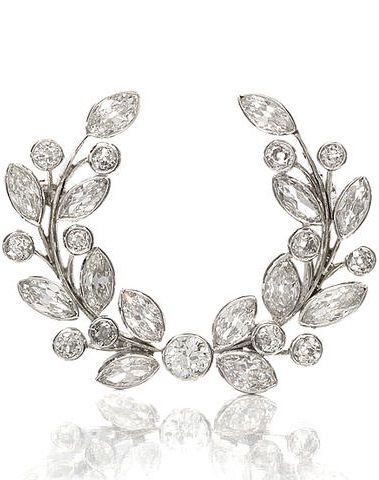 A diamond wreath brooch, first half of the 20th century. Set throughout with old...