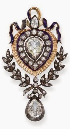 An Antique Diamond and Enamel Brooch Set with a central pear-shaped diamond with...