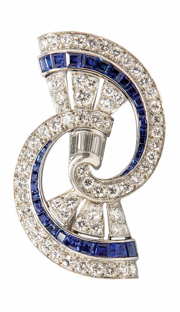 An Art Deco Platinum, Diamond, and Synthetic Sapphire Brooch, set with baguette ...
