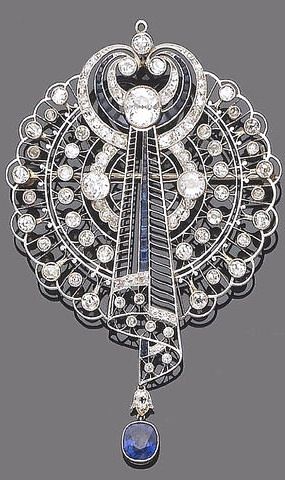 An early 20th century sapphire and diamond brooch pendant The openwork plaque of...