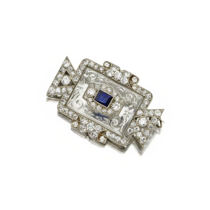 CARVED ROCK CRYSTAL, SAPPHIRE AND DIAMOND BROOCH, CARTIER, CIRCA 1920
